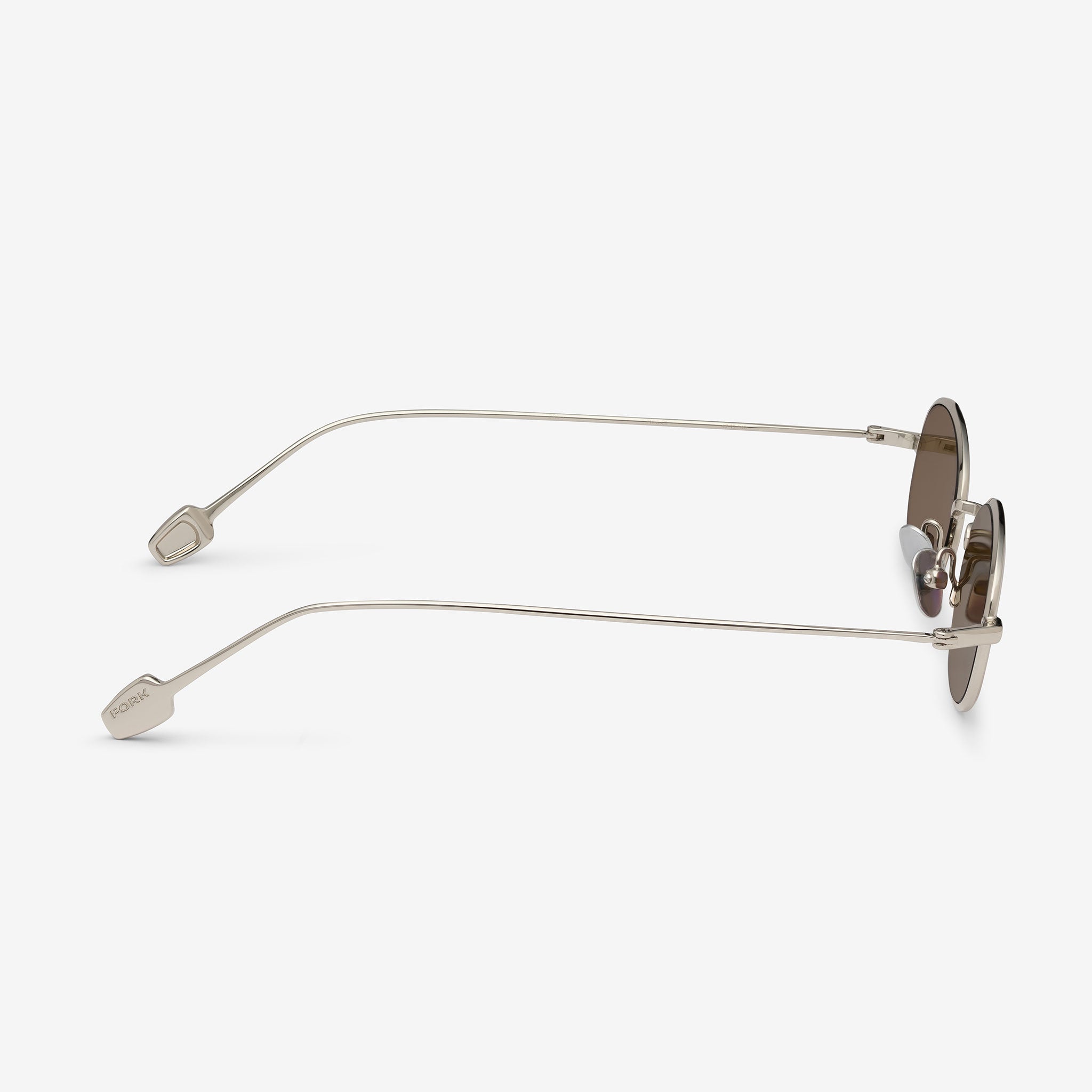 Sunglasses with thin metal frame on a white background