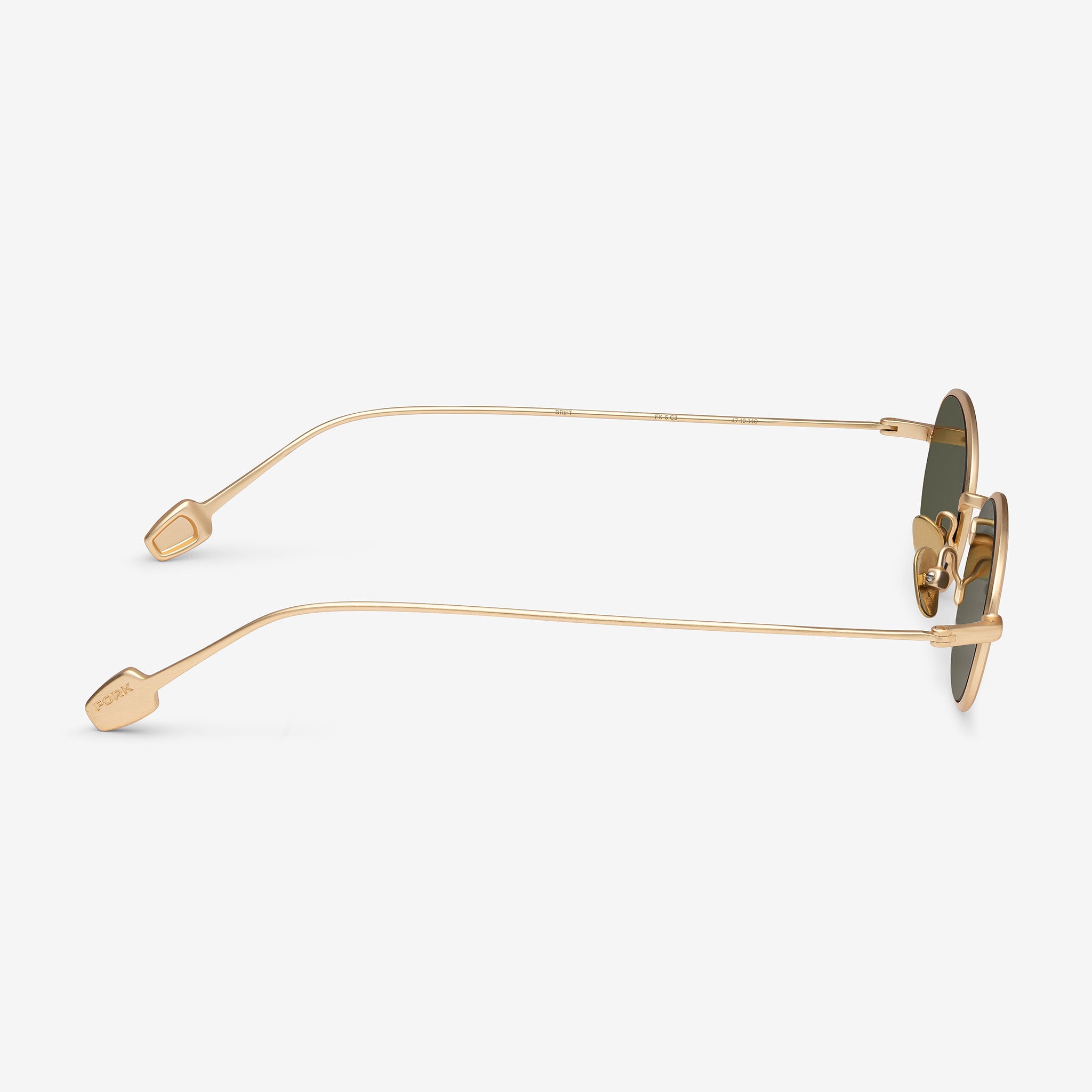 Gold-framed sunglasses on a white background